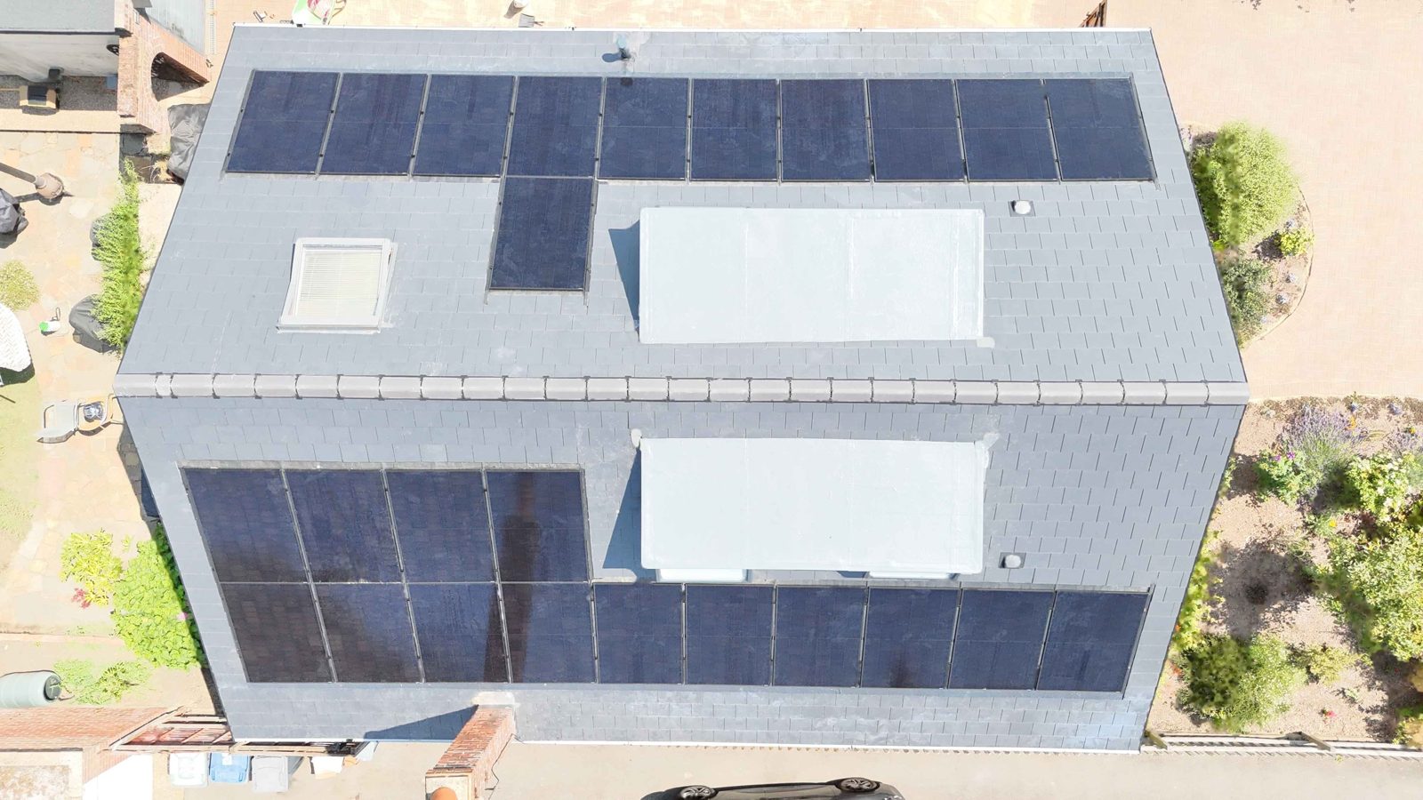 In-roof solar panels set into a new roof in Canterbury, seen from above, by StoneRidge Roofing