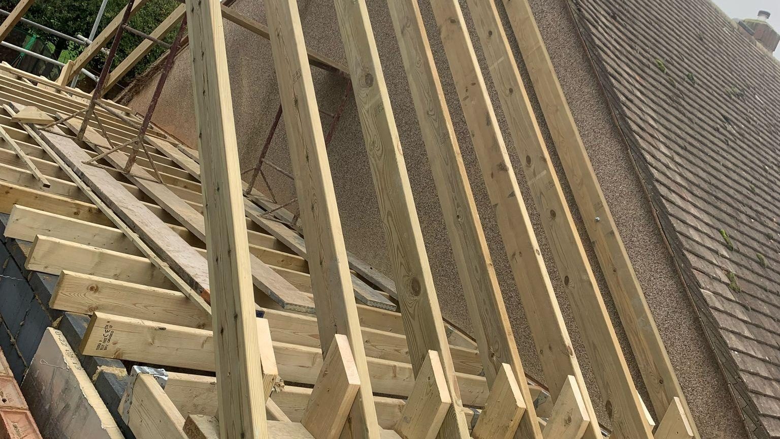 New timber roof trusses going up on a StoneRidge Roofing job in Dover