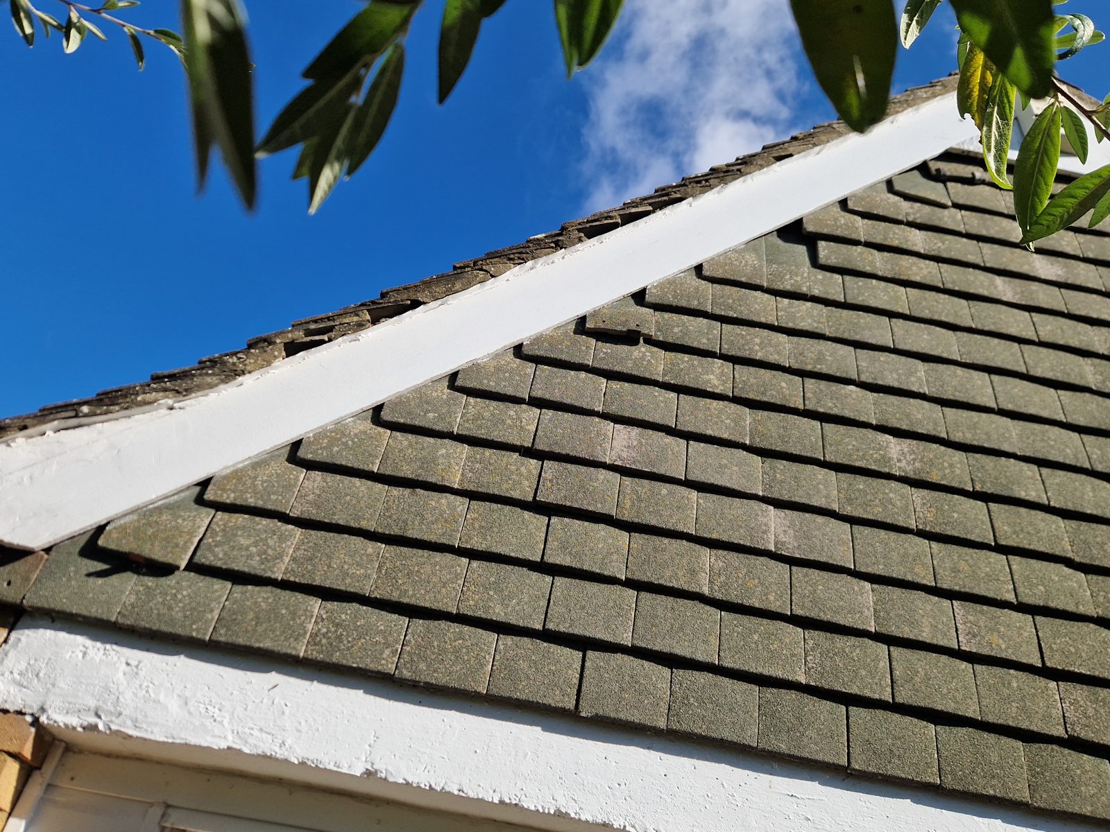 Tiled roof with the gable verge re-bedded and painted after a repair by StoneRidge Roofing
